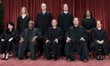 Members of the Supreme Court sit for a new group portrait at the Supreme Court building in Washington on October 7