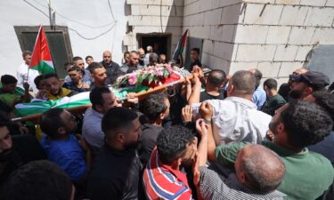 Mourners carry the body of 19-year-old Palestinian Qusai Jamal Maatan