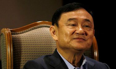 Former Thai Prime Minister Thaksin Shinawatra looks on during an interview in Singapore on February 23