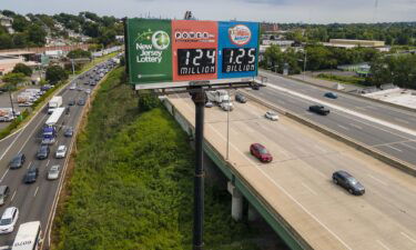 A billboard over Interstate 80 in New Jersey promotes a Mega Millions lottery jackpot of $1.25 billion.