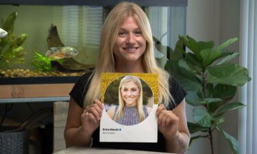 Courtney Ballesteros holds a photo of a fake Twitter account that used her photo for the profile picture.