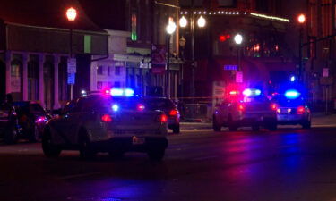 Authorities respond to the scene of a shooting in downtown Louisville early Sunday
