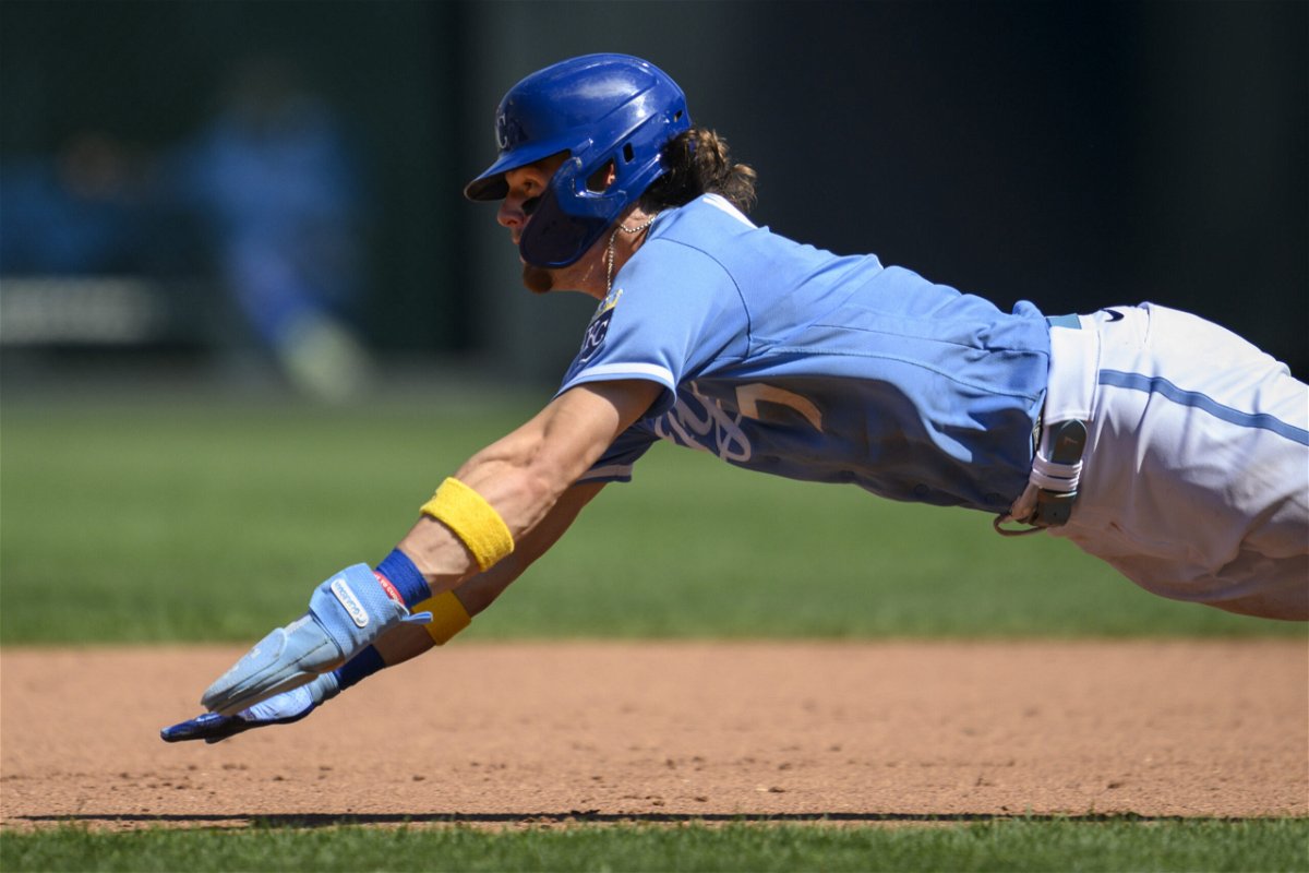 Kansas City Royals' Bobby Witt Jr. dives into second base safe ahead of the throw to Boston Red Sox second baseman Enmanuel Valdez during the sixth inning of a baseball game, Sunday, Sept. 3, 2023, in Kansas City, Mo. 