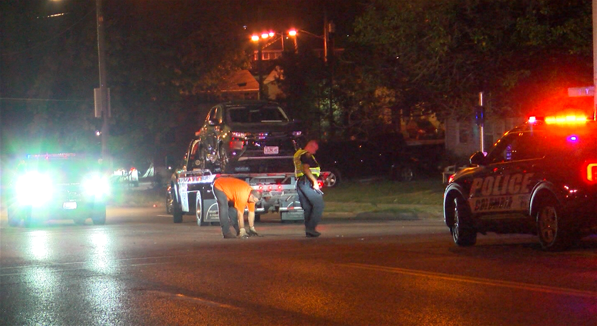 Tow truck crews remove a damaged car involved in a crash on Providence Road on Monday night in Columbia. The driver of the car said another car T-boned her at the Rogers Street intersection.