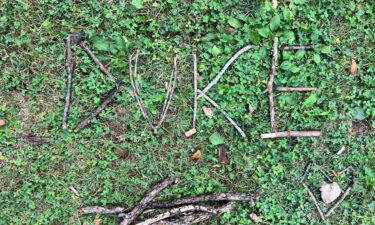 Sticks are carefully placed to spell out "Duke."