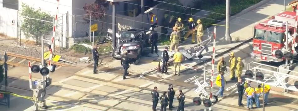 <i></i><br/>Rescue crews responded to a collision between a Metro train and a car at S Raymond Avenue and E. California Blvd. in Pasadena to help a driver trapped in their vehicle following the crash.