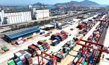 Large machinery loads containers at the China-Kazakhstan (Lianyungang) logistics Cooperation base in Lianyungang