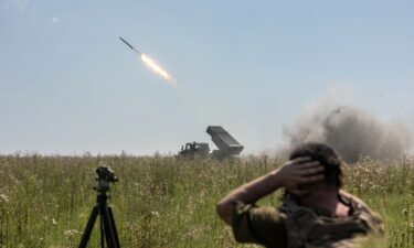 Ukrainian soldiers attach detonators to grad shells on August 9.