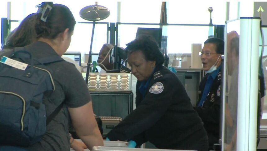 FILE - Passengers go through a TSA checkpoint at the Columbia Regional Airport.