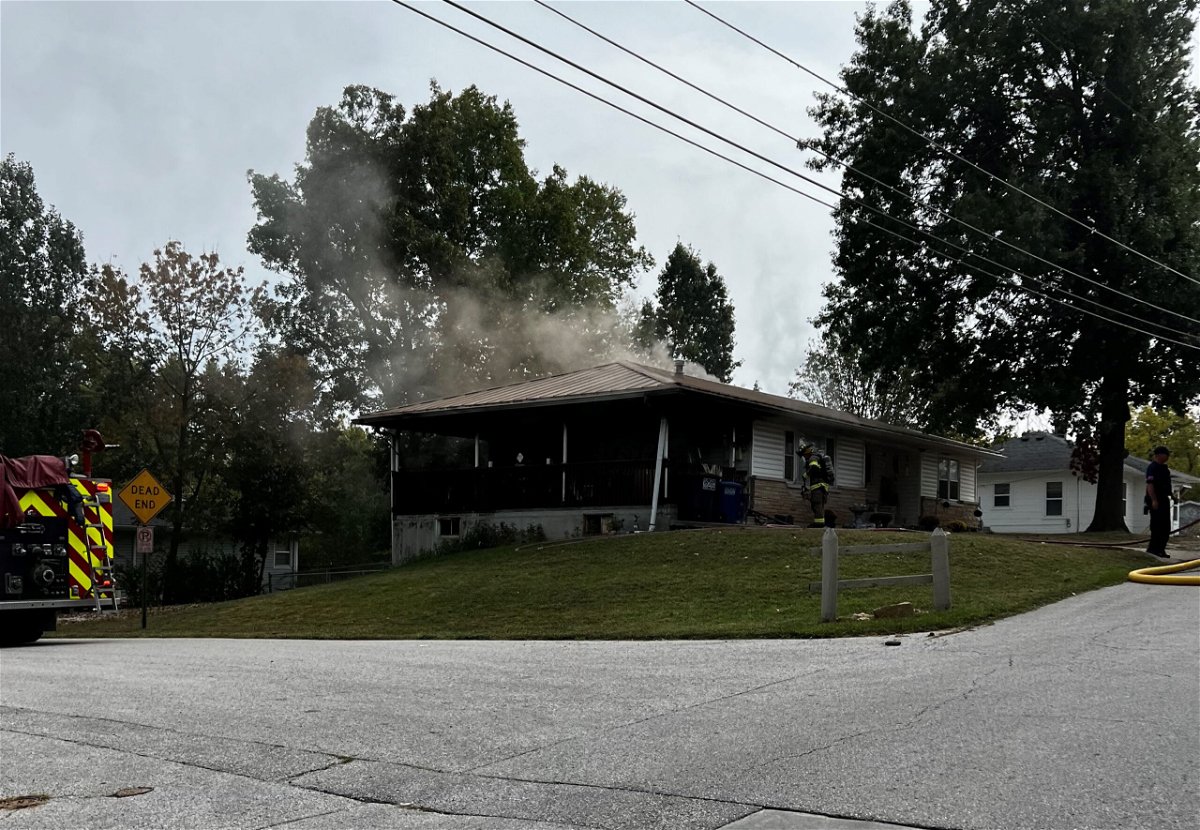 Smoke rises from a home on South Ravine Street in Fulton on Tuesday, Oct. 3, 2023.