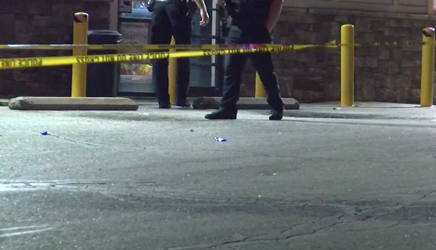 FILE - Columbia police investigate a shooting earlier this year outside a liquor store.