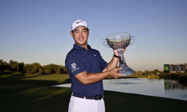 Kim toasts his win on the 18th green.