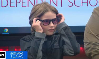 5th grader Jaron Casillas puts on colorblind glasses for the first time.