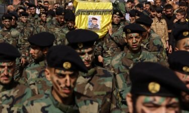Members of Hezbollah carry the coffin of Hezbollah member Abbas Shuman