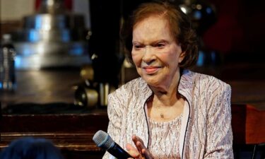 Former first lady Rosalynn Carter sits a reception to celebrate her and former President Jimmy Carter's 75th wedding anniversary in Plains