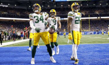 Owens (34) celebrates scoring a touchdown against the Detroit Lions.