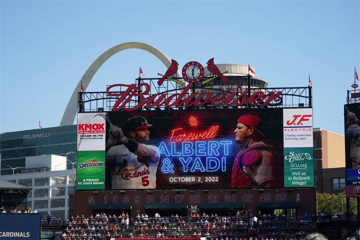 File - a video screen is seen in Busch Stadium as St. Louis Cardinals' Albert Pujols (5) and Yadier Molina (4) are honored during a ceremony before the start of the Cardinals' final regular season baseball game Sunday, Oct. 2, 2022, against the Pittsburgh Pirates in St. Louis.  The Cardinals and the world’s leading brewer, Anheuser-Busch, announced, Wednesday, Dec. 13, 2023 that the two historic St. Louis institutions have agreed to a five-year extension of their long-term marketing agreement through 2030.