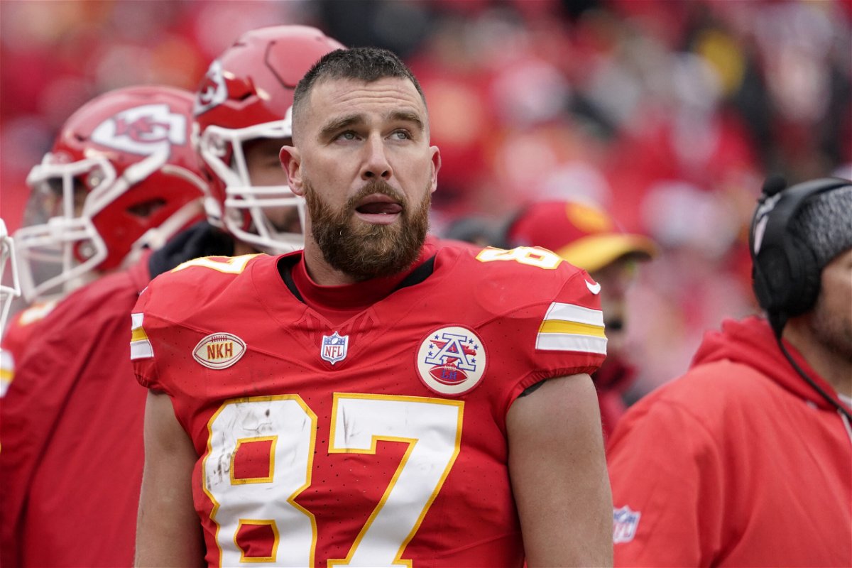 Kansas City Chiefs tight end Travis Kelce watches from the sidelines during the first half of an NFL football game against the Las Vegas Raiders Monday, Dec. 25, 2023, in Kansas City, Mo.