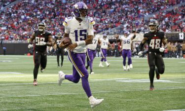 Josh Dobbs warms up prior to the Minnesota Vikings' game against the Chicago Bears at U.S. Bank Stadium on November 27