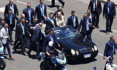 Javier Milei is handed the Presidential cane by his predecessor Alberto Fernandez during his inauguration ceremony.