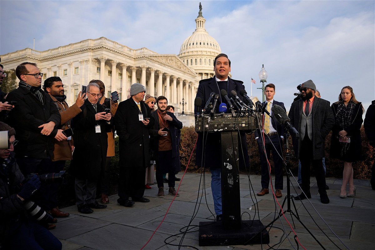 Rep. George Santos talks to reporters outside the US Capitol on November 30, in Washington, DC.
