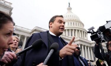 Rep. George Santos (R-NY) is surrounded by journalists as he leaves the U.S. Capitol after his fellow members of Congress voted to expel him from the House of Representatives on December 1