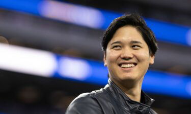 Los Angeles Dodgers' Shohei Ohtani smiles before an NFL football game between the Los Angeles Rams and the New Orleans Saints on December 21.