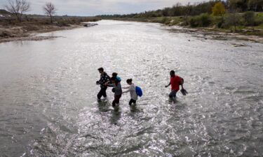 An immigrant family crosses to the American side of the Rio Grande on December 19