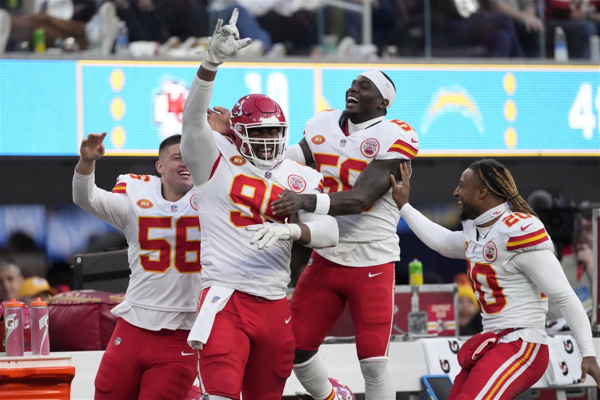 Kansas City Chiefs defensive tackle Chris Jones, second from left, celebrates with teammates after sacking Los Angeles Chargers quarterback Easton Stick during the second half of an NFL football game, Sunday, Jan. 7, 2024, in Inglewood, Calif. The sack earned Jones a $1.25 million contract incentive. 