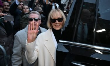 Writer E. Jean Carroll waves as she leaves federal court after the verdict in her defamation case against former President Donald Trump in New York on January 26.