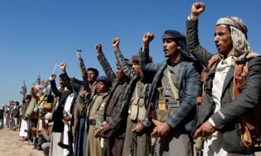 Houthi fighters and tribesmen stage a rally against the US and the UK strikes on Houthi-run military sites near Sanaa