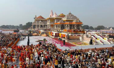 A man prays on the banks of Sarayu River on the occasion of Ram temple's consecration ceremony in Ayodhya on January 22.