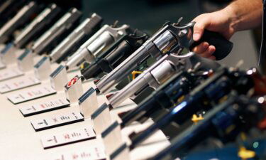 Handguns are displayed at the Smith & Wesson booth at the Shooting