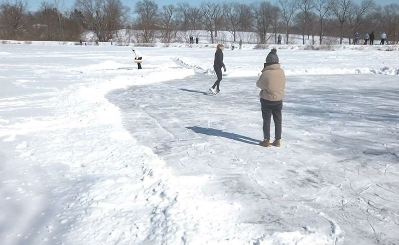FILE - Skaters take to the ice at Stephens Lake Park in 2021.
