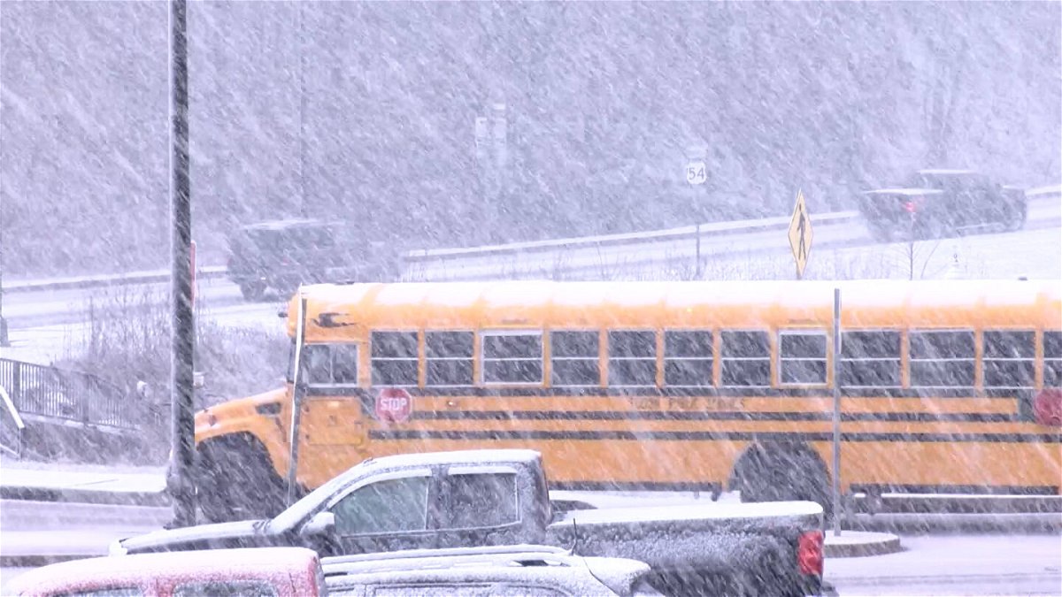 A Fulton Public Schools bus drives in the snow Monday, Jan. 8, 2024, as a winter storm begins to hit Mid-Missouri.