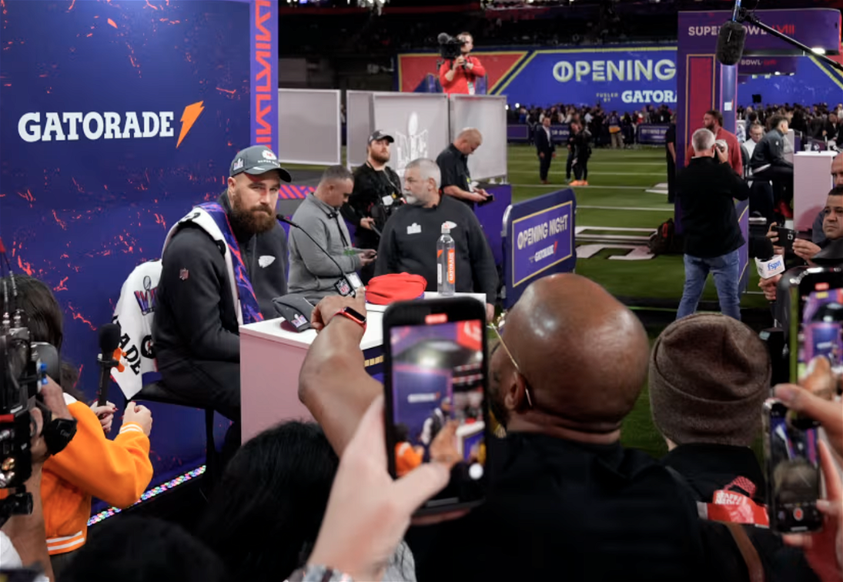 Kansas City Chiefs tight end Travis Kelce, left, participates in the NFL football Super Bowl 58 opening night, Monday, Feb. 5, 2024, in Las Vegas. The San Francisco 49ers face the Kansas City Chiefs in Super Bowl 58 on Sunday.