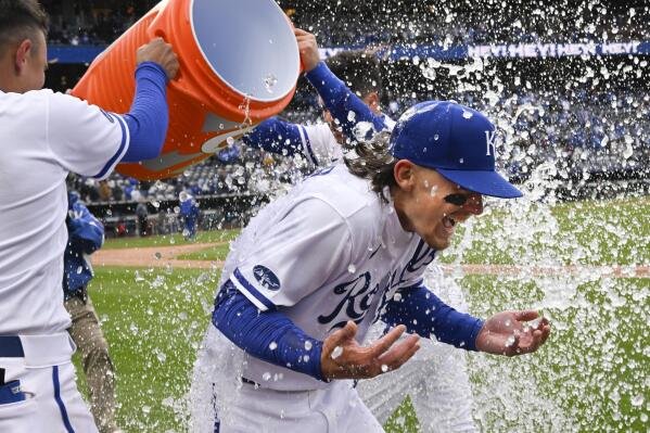 Kansas City Royals' Bobby Witt Jr. is doused with ice by Nicky Lopez, left, and Whit Merrifield, behind, after they beat the Cleveland Guardians in a baseball game, Thursday, April 7, 2022 in Kansas City, Mo. 