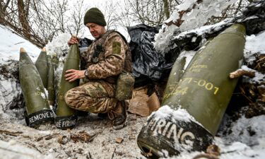 A Ukrainian serviceman prepares 155-mm artillery shells near the front line in Zaporizhzhia