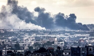Smoke billows during Israeli bombardment on Khan Yunis from Rafah in the southern Gaza Strip early on January 3