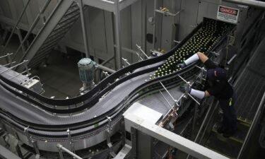 Bottles of Stella Artois brand beer move along the production line at the Anheuser-Busch Budweiser bottling facility in St. Louis
