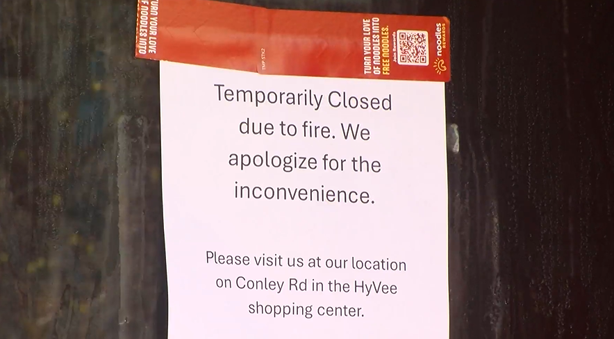 A sign posted to the front of the Noodles and Company downtown Columbia restaurant stating that the location would be temporarily closed, due to damage from a fire that occurred on Sunday. 