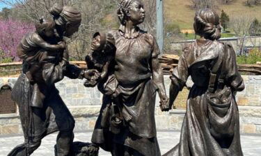 The Sowing the Seeds of the Future sculpture depicts three women -- a Cherokee woman