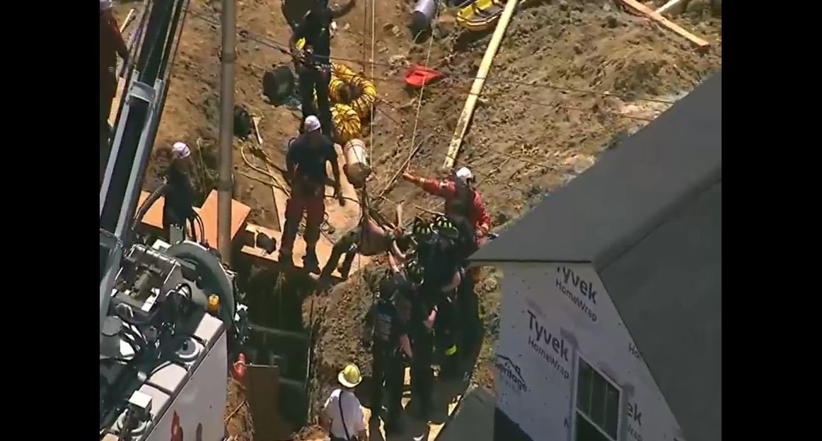 <i>WANF via CNN Newsource</i><br/>Emergency crews rescued a worker who was buried up to his chest in a trench 20 feet below ground level for more than three hours on Friday