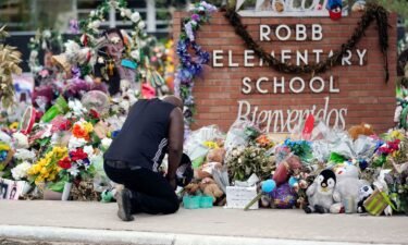 Reggie Daniels pays his respects at a memorial at Robb Elementary School on June 9