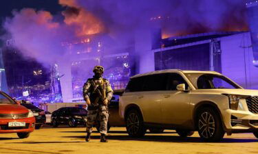 Vehicles of Russian emergency services near the burning Crocus City Hall concert venue following the attack on March 22.