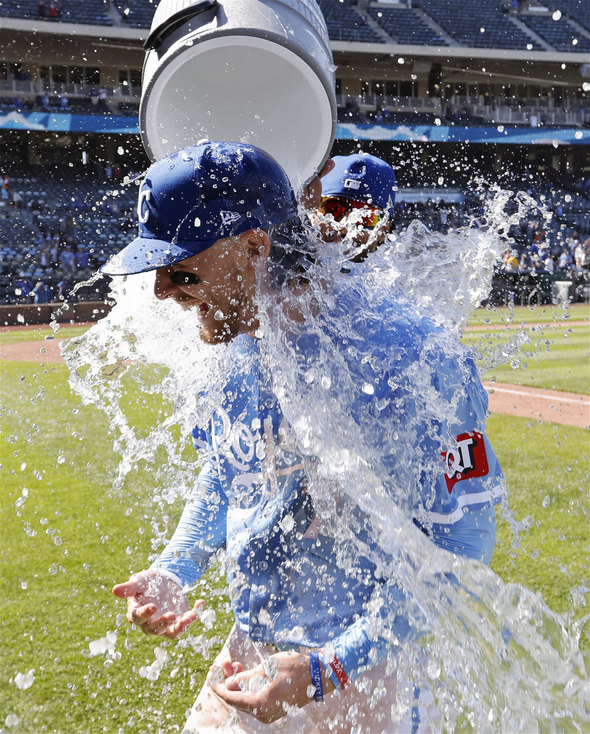 Kansas City Royals' Bobby Witt Jr., front, is doused by teammate MJ Melendez at the end of a baseball game against the Houston Astros in Kansas City, Mo., Thursday, April 11, 2024. (AP Photo/Colin E. Braley)