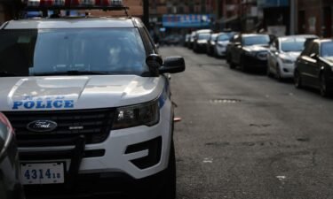 A police car drives through Manhattan on January 14