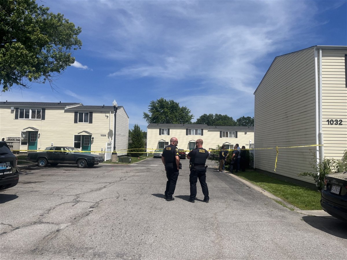 Several Columbia police officers stand near crime scene tape on Thursday, May 30, 2024, at Columbia Square Apartments on Claudell Lane.