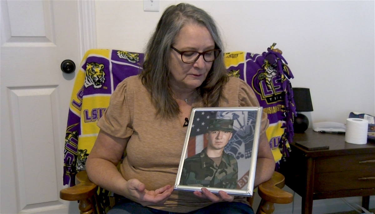 Tammie Thomas, of Columbia, holds a photo of her son Cory Lake on Monday. Thomas told ABC 17 News that she accidentally donated Lake’s Class A uniform to the Salvation Army last week. She is asking for help locating it. 