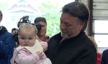 John Stickovich reunites with 11-month-old Opal whom he pulled from a house fire on Monday
